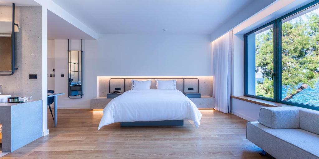 Postel nebo postele na pokoji v ubytování Amario Suites Hotel