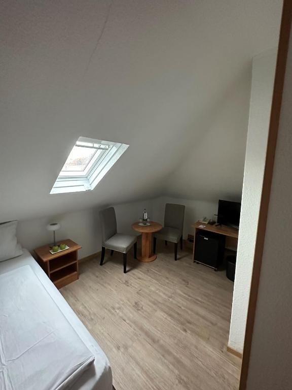 Postel nebo postele na pokoji v ubytování Hotel Goldenes Lamm