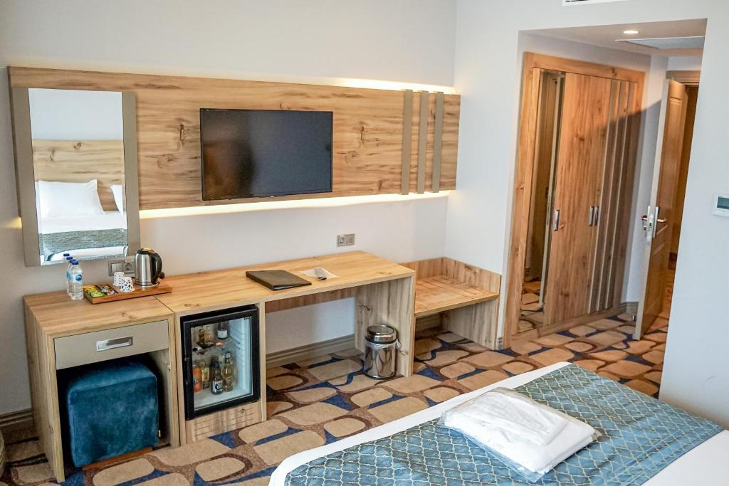 Postel nebo postele na pokoji v ubytování BLUE MUDANYA HOTEL