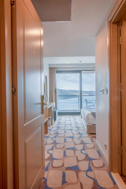 Postel nebo postele na pokoji v ubytování BLUE MUDANYA HOTEL