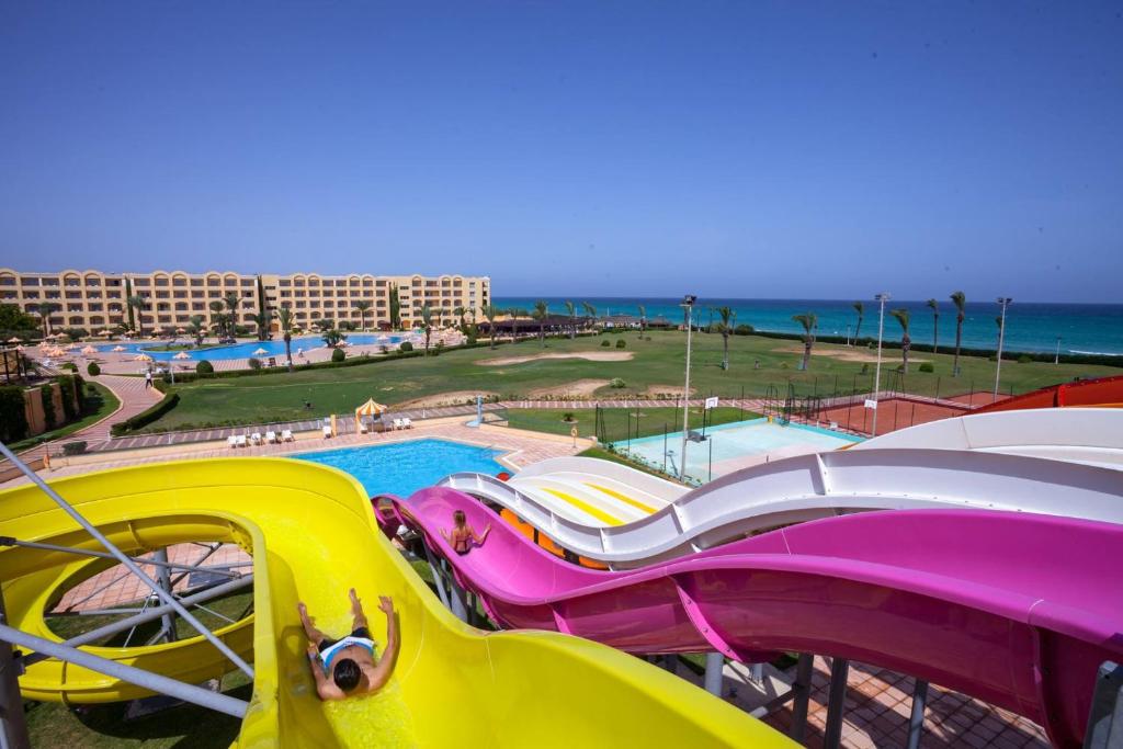 a water park with a slide and a roller coaster at Hotel Nour Palace Resort & Thalasso Mahdia in Mahdia