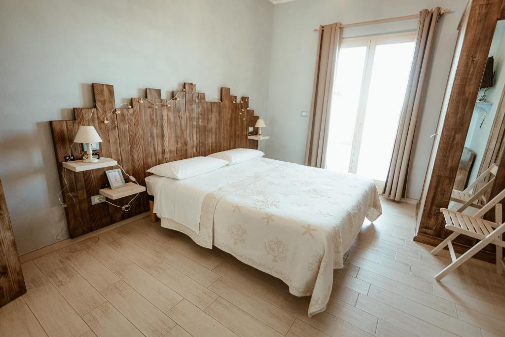 Postel nebo postele na pokoji v ubytování B&B Il Mare In Una Stanza