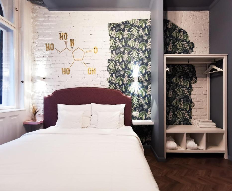 Voodi või voodid majutusasutuse Metropolis Budapest Boutique Hotel toas
