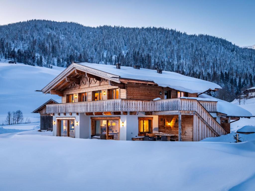 a log cabin in the snow in the winter at Apartment Orleans 1 by Interhome in Hinterthal