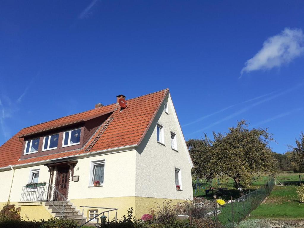 a large white house with a red roof at Apartment Am Meintetal by Interhome in Lügde