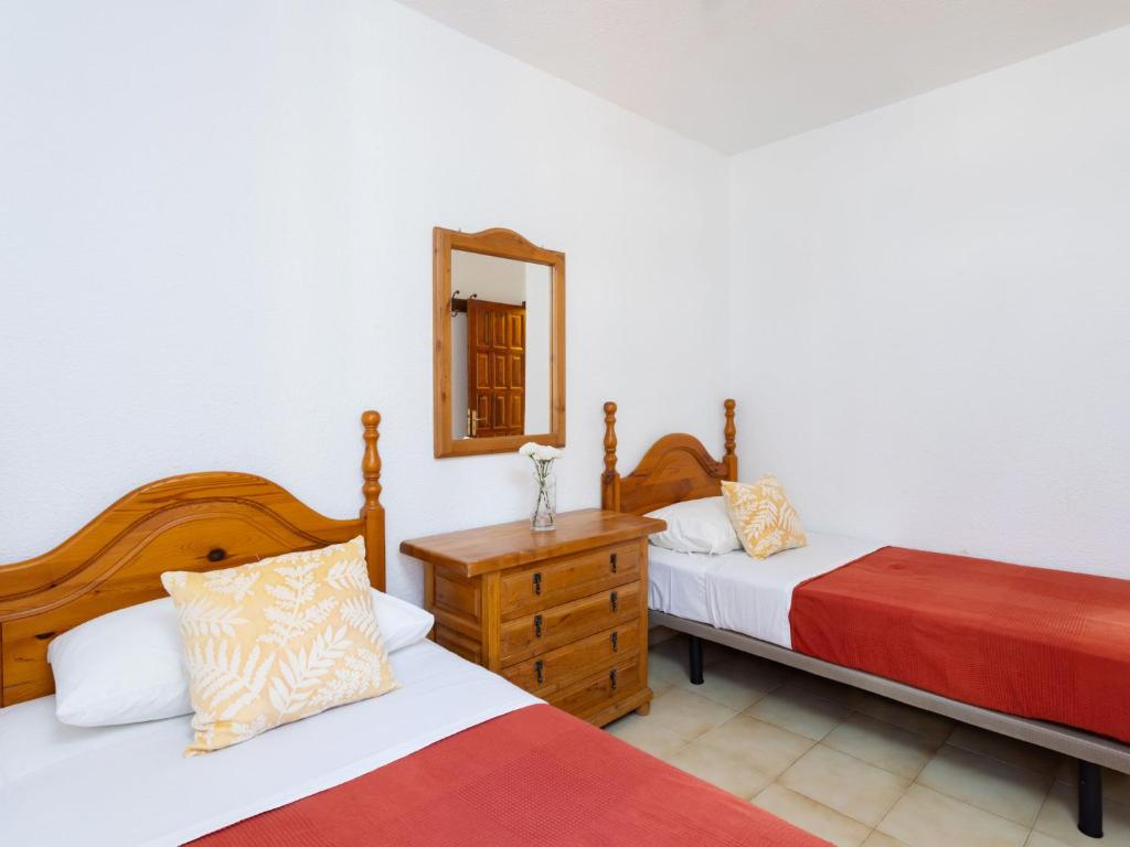 A bed or beds in a room at Apartment Comfy Altemar-2 by Interhome