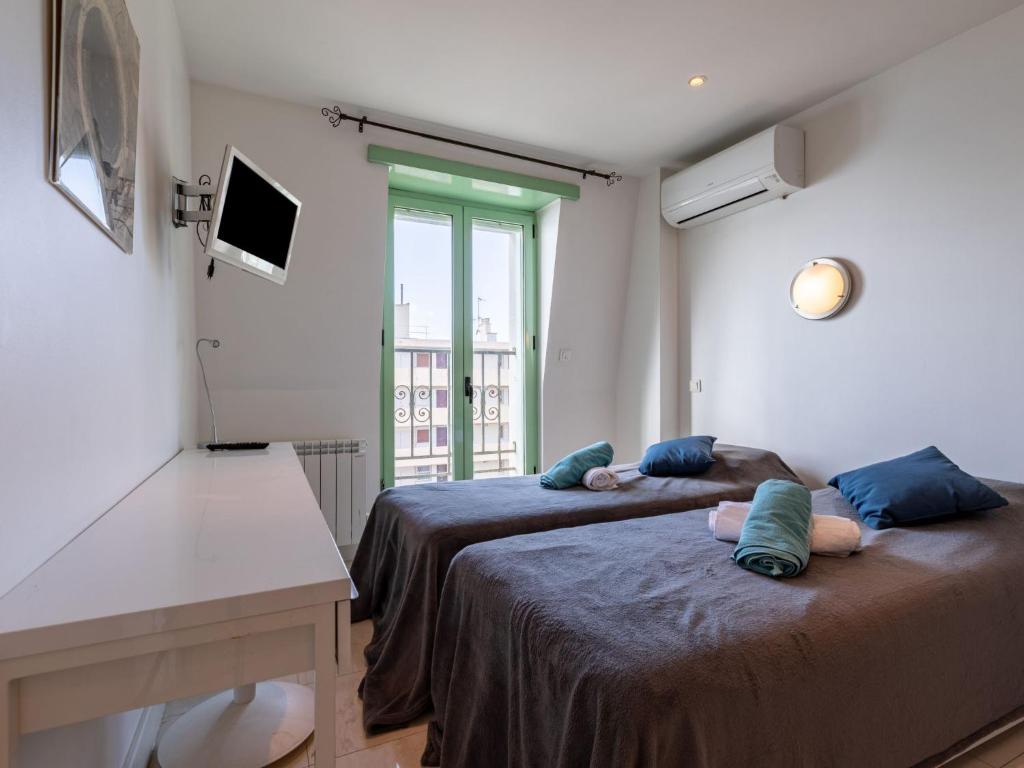 Łóżko lub łóżka w pokoju w obiekcie Apartment Les Araucarias by Interhome