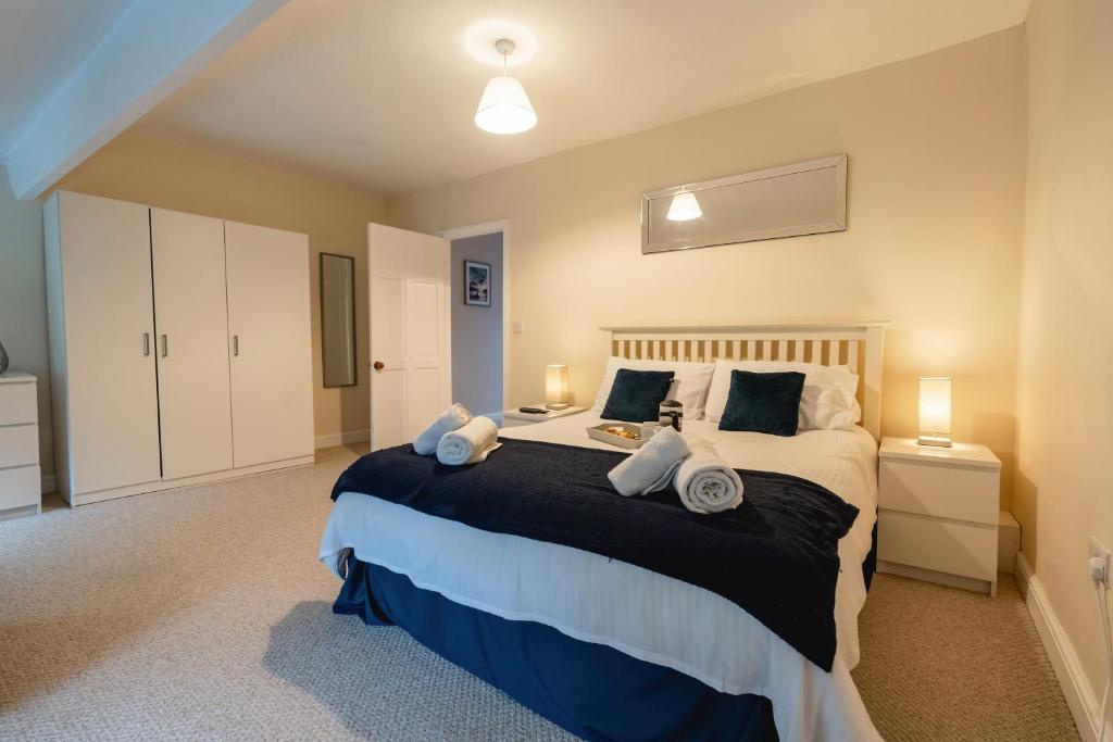 a bedroom with a large bed in a room at Church Cottage in Maryport