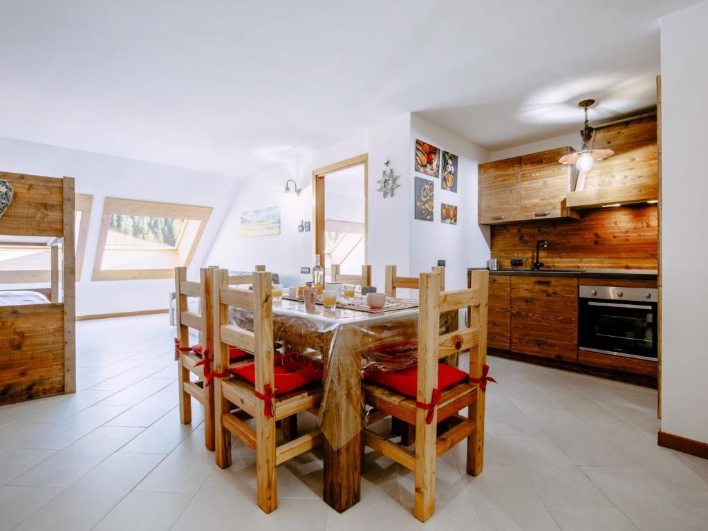 a dining room with a table and chairs at Apartment Torrita di Canazei by Interhome in Alba di Canazei