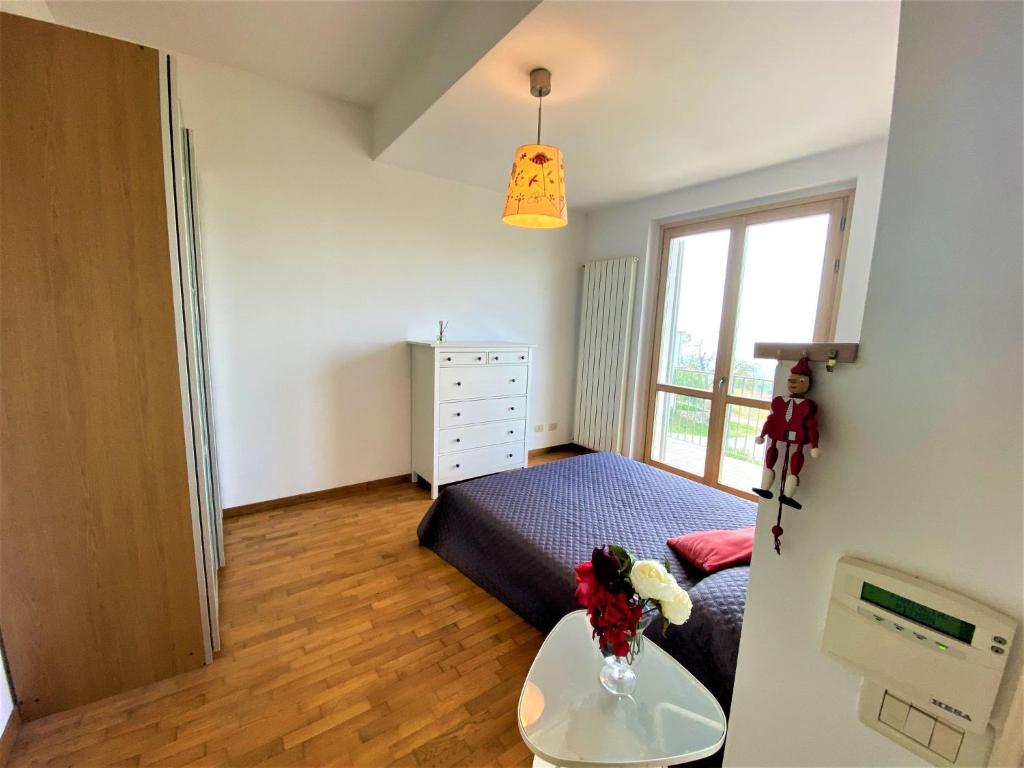 Łóżko lub łóżka w pokoju w obiekcie Holiday Home Casa Chiara by Interhome