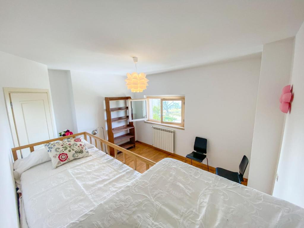 Łóżko lub łóżka w pokoju w obiekcie Holiday Home Casa Chiara by Interhome