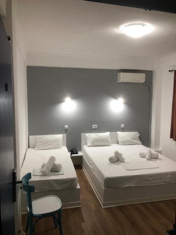 Ένα ή περισσότερα κρεβάτια σε δωμάτιο στο Sparta Team Hotel