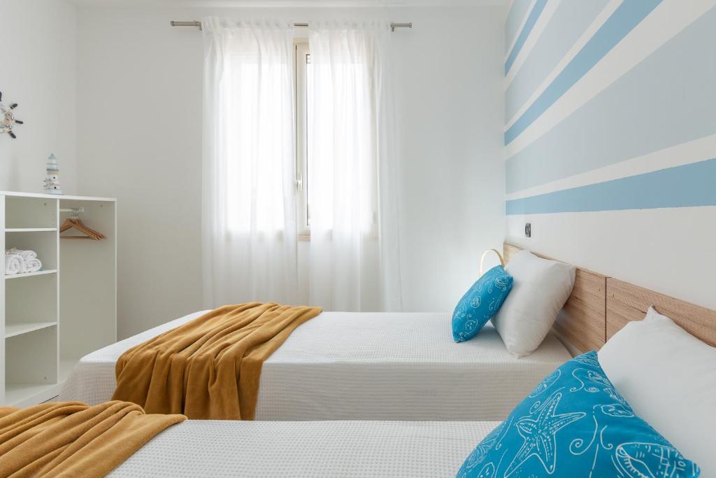 Łóżko lub łóżka w pokoju w obiekcie Villa Palma
