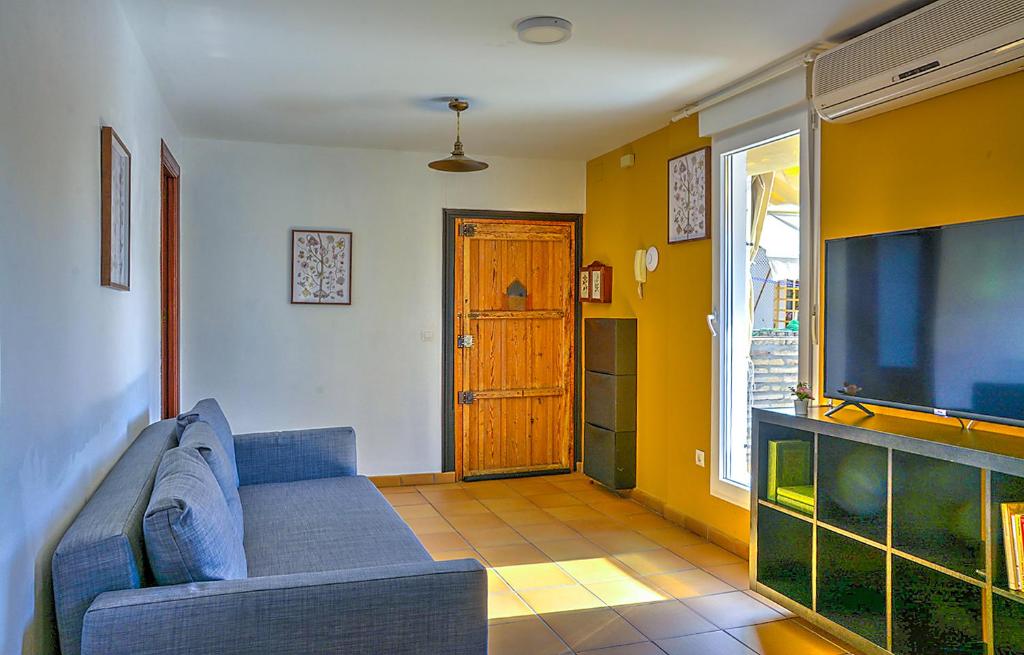 Televízia a/alebo spoločenská miestnosť v ubytovaní Apartamento Casa Pilatos