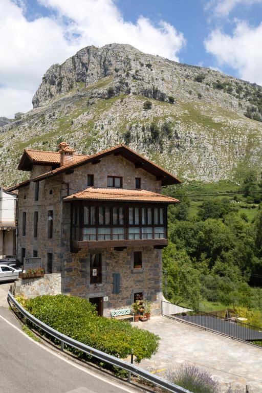 a building on the side of a mountain at Posada 3 Valles in Liérganes