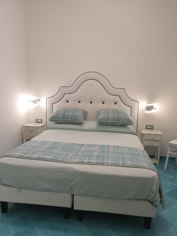 Postel nebo postele na pokoji v ubytování Albergo S. Andrea