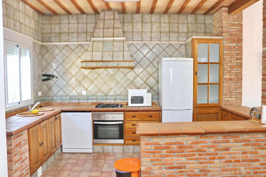 Kuchyňa alebo kuchynka v ubytovaní Chalet Pradillo II