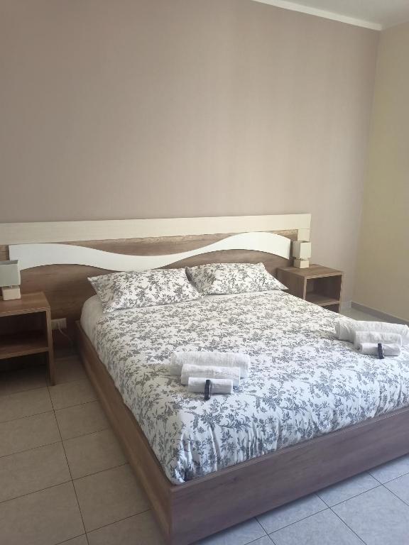 Postel nebo postele na pokoji v ubytování B&B AEREOSTATION