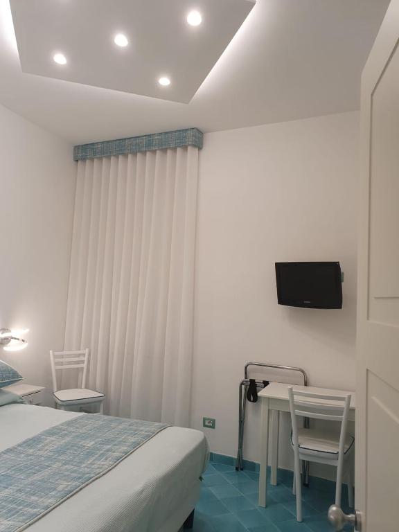 Postel nebo postele na pokoji v ubytování Albergo S. Andrea