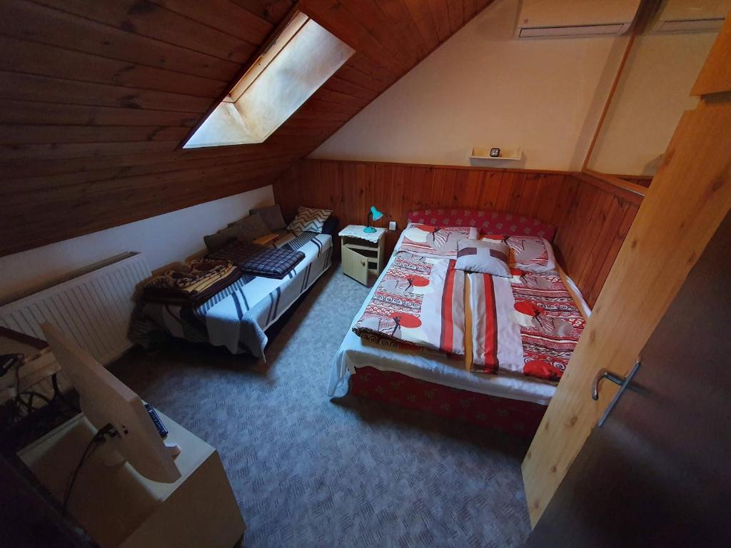 Postel nebo postele na pokoji v ubytování Pereszlényi Vendégház