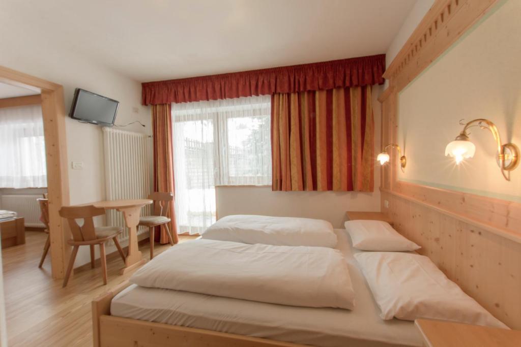 Postel nebo postele na pokoji v ubytování B&B Apartments La Palsa