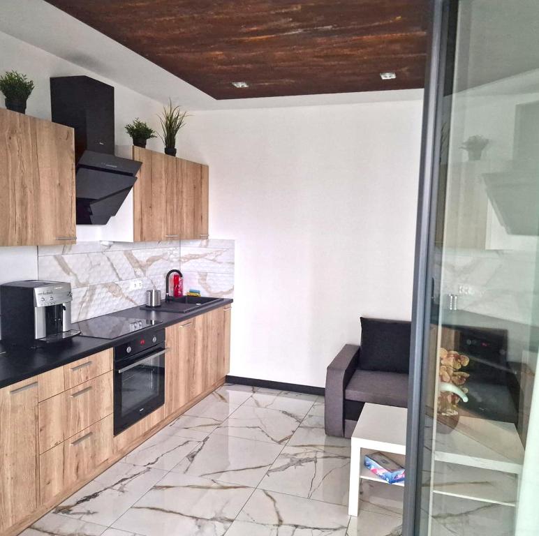 Kuchyňa alebo kuchynka v ubytovaní Apartamenty nad jeziorem Białym KA-BOATS