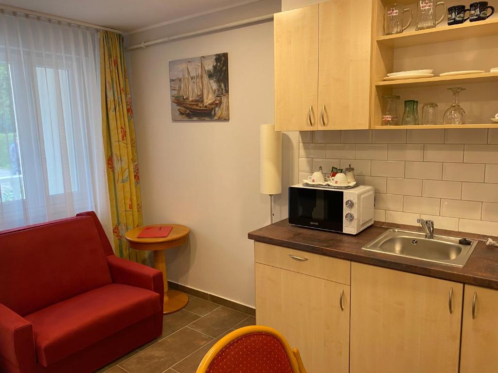 Kuchnia lub aneks kuchenny w obiekcie Aurora Béta Apartman's