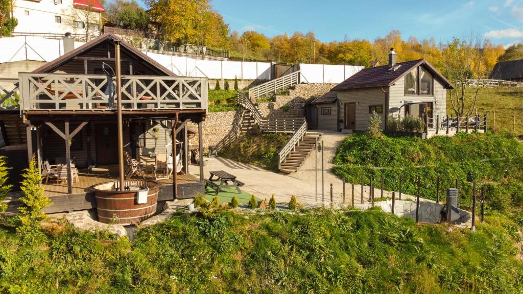 an aerial view of a house with a yard at Amonte Mountain Resort in Muntele Rece