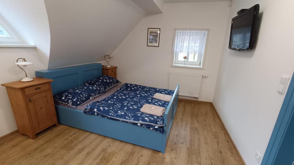 Postel nebo postele na pokoji v ubytování Apartmány stará škola