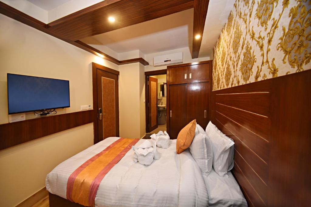Postel nebo postele na pokoji v ubytování Hotel Simal