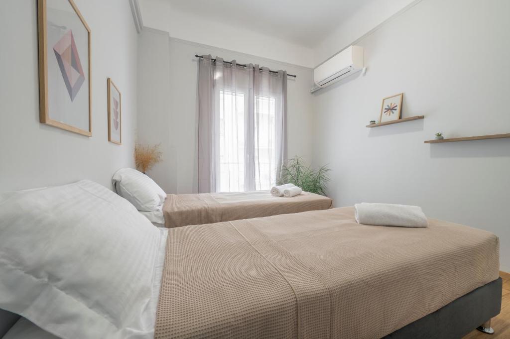 Posteľ alebo postele v izbe v ubytovaní Luxury 2 bdroom apt- Megaro Mousikis