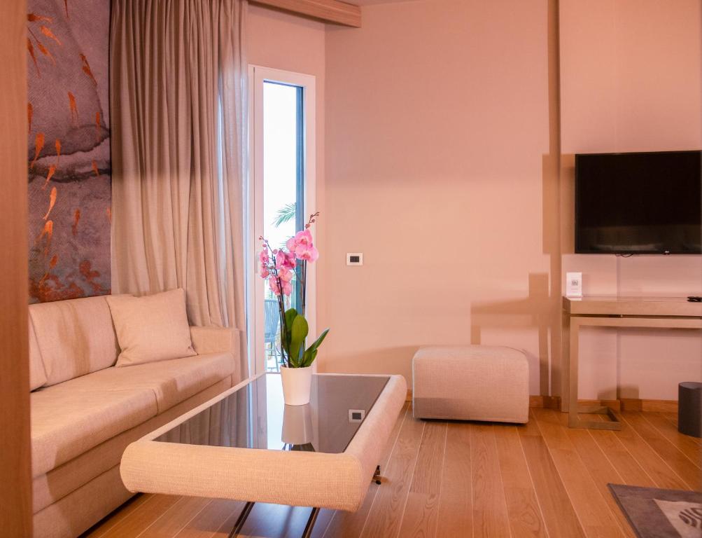 a living room with a couch and a table at Miramare Suites in Sestri Levante