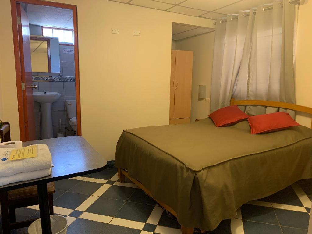 Postel nebo postele na pokoji v ubytování Hotel Acuario