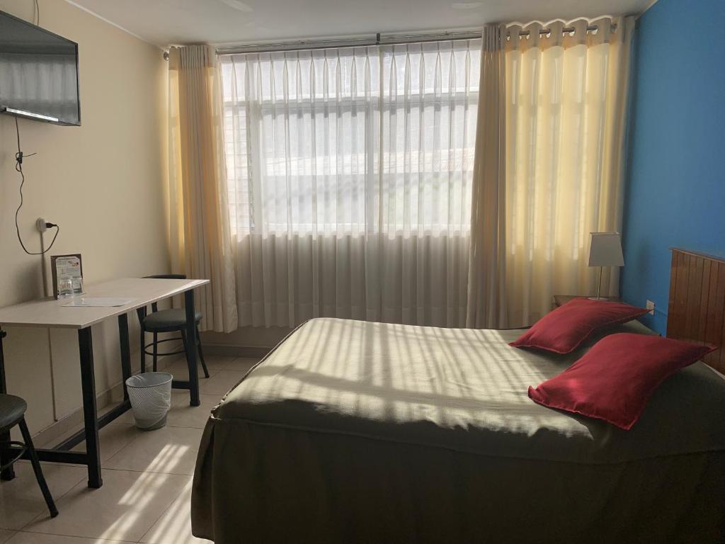 Postel nebo postele na pokoji v ubytování Hotel Acuario