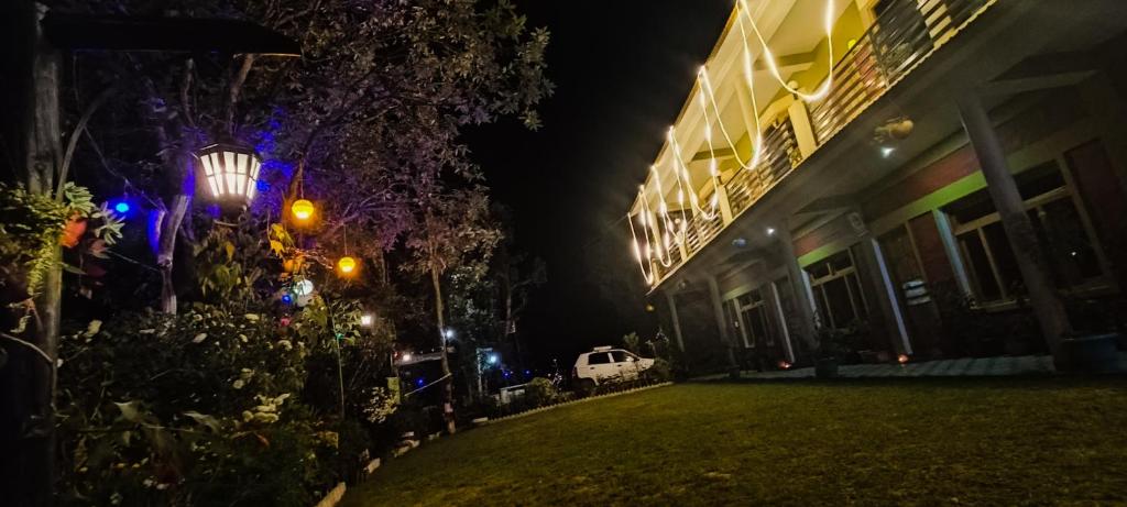 a house at night with a car parked next to it at JMT Eco-Binsar by StayApart in Panuānaula
