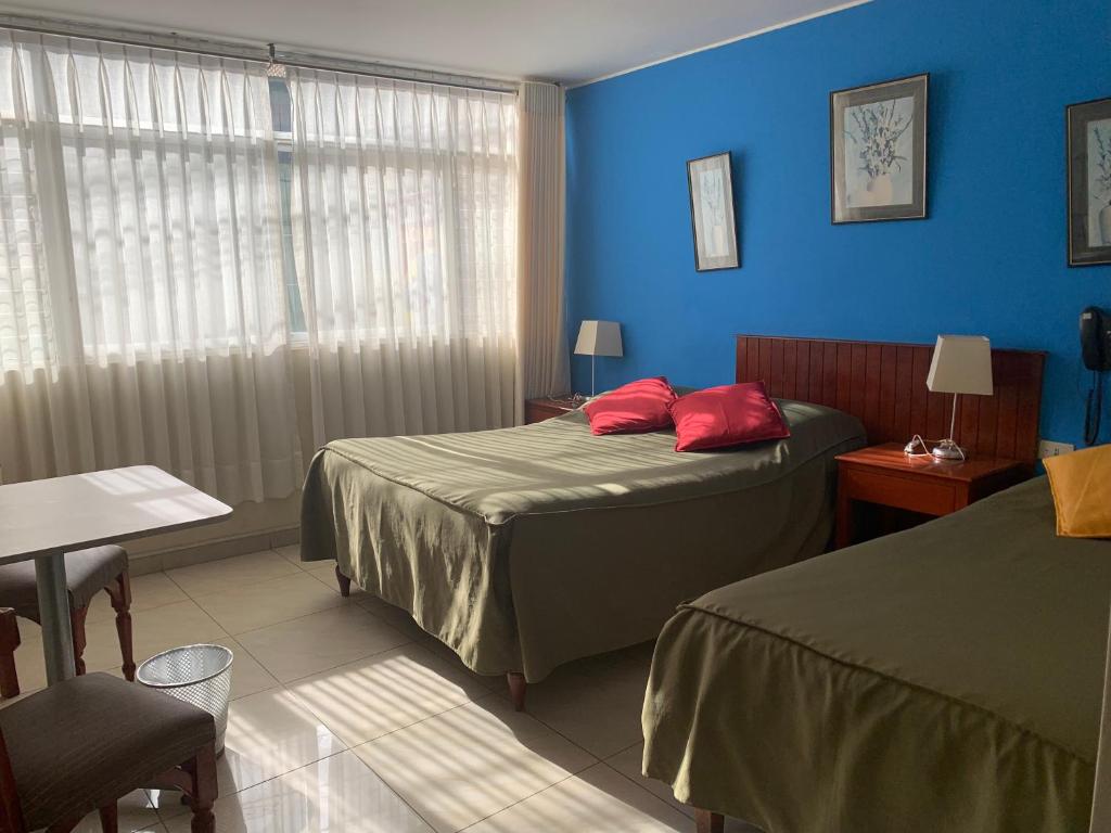 Postel nebo postele na pokoji v ubytování Hotel Acuario