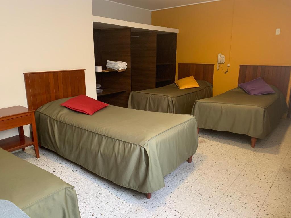 Postel nebo postele na pokoji v ubytování Hotel Acuario
