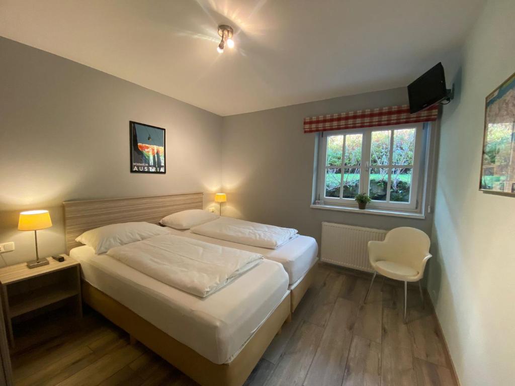 Posteľ alebo postele v izbe v ubytovaní AlpinResort Kaprun 5