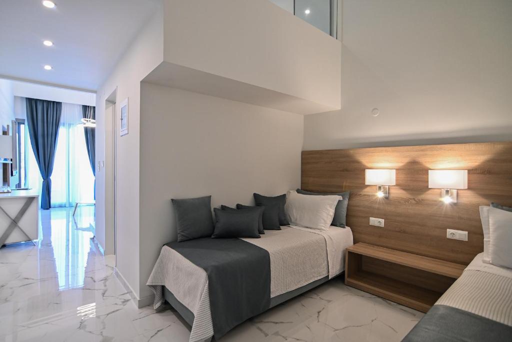 Postel nebo postele na pokoji v ubytování Rihios Hotel