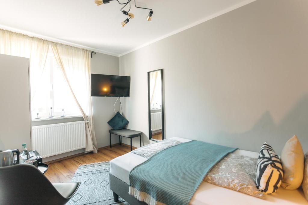 Postel nebo postele na pokoji v ubytování Das Schlafgut Dessau