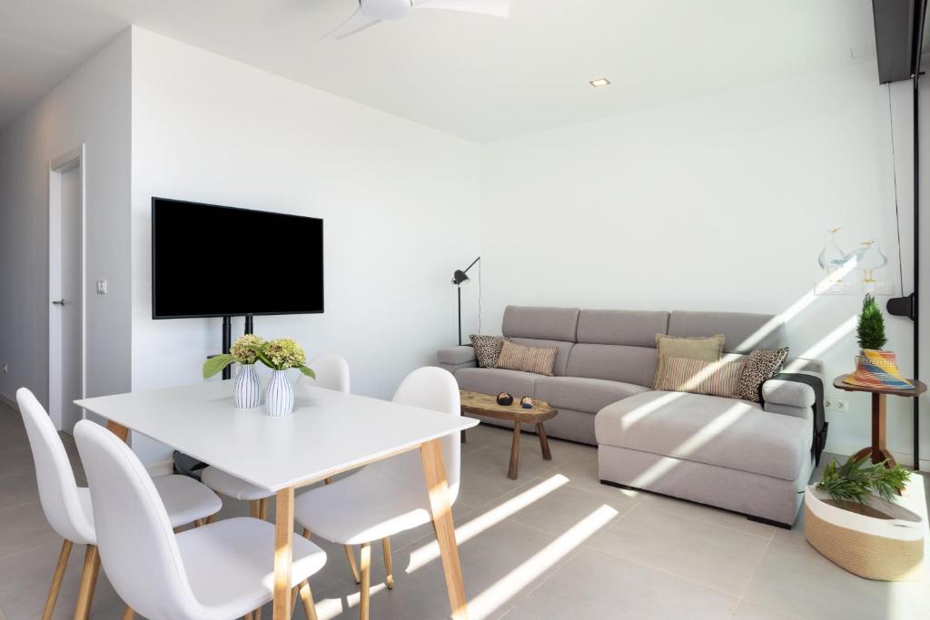 A seating area at Home2Book Design & Breathtaking Sea Views El Porís