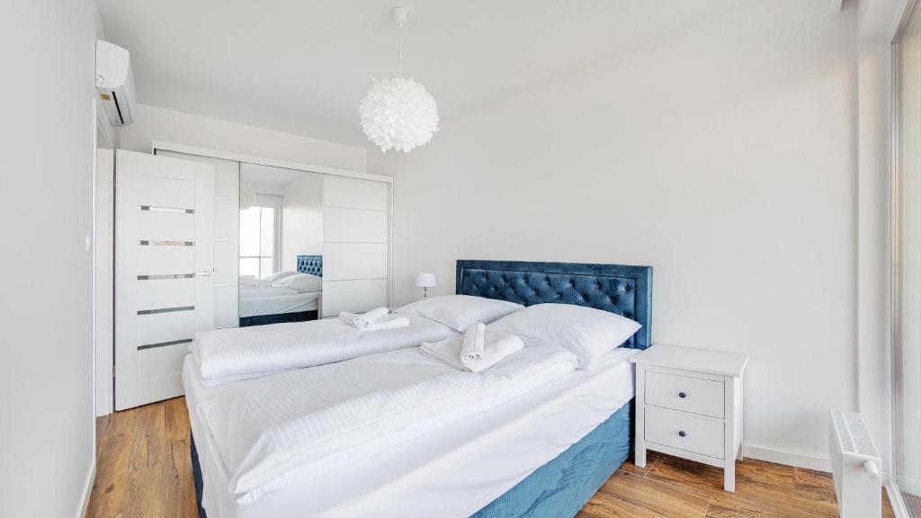 Posteľ alebo postele v izbe v ubytovaní Prywatne apartamenty Sun & Snow w obiekcie Ustronie Apartments