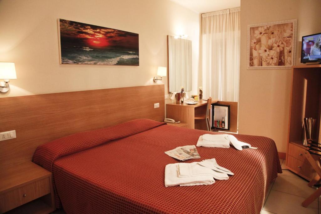 Postel nebo postele na pokoji v ubytování Hotel Majorca sul Mare in centro a Riccione