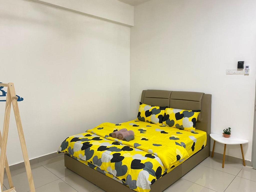 Postel nebo postele na pokoji v ubytování 休闲民宿 Leisure Homestay @The Venus Sitiawan