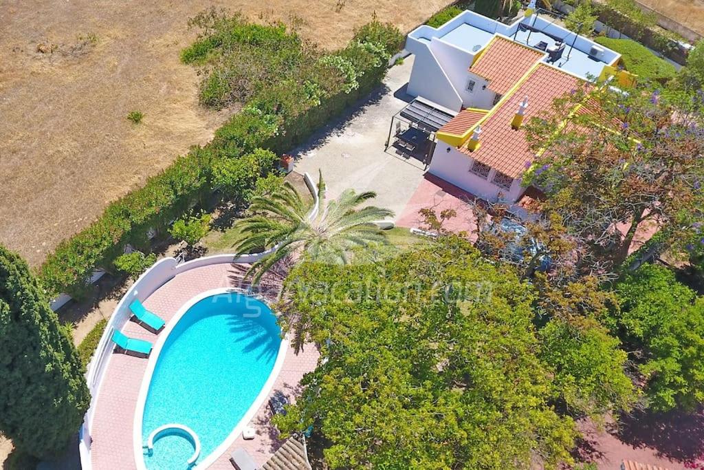 an aerial view of a house with a swimming pool at Villa Felicity in Porches