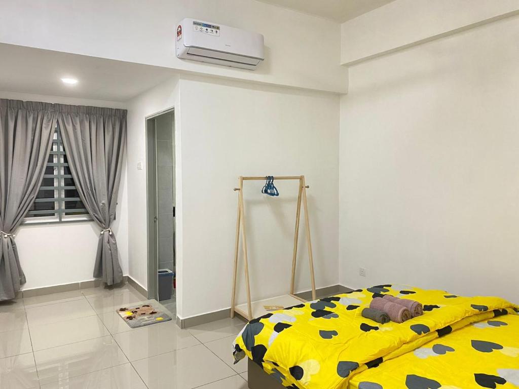 Postel nebo postele na pokoji v ubytování 休闲民宿 Leisure Homestay @The Venus Sitiawan