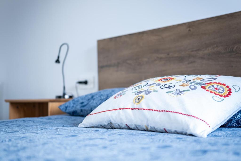 a pillow sitting on top of a bed at Apartment Biscan in Sveta Nedjelja