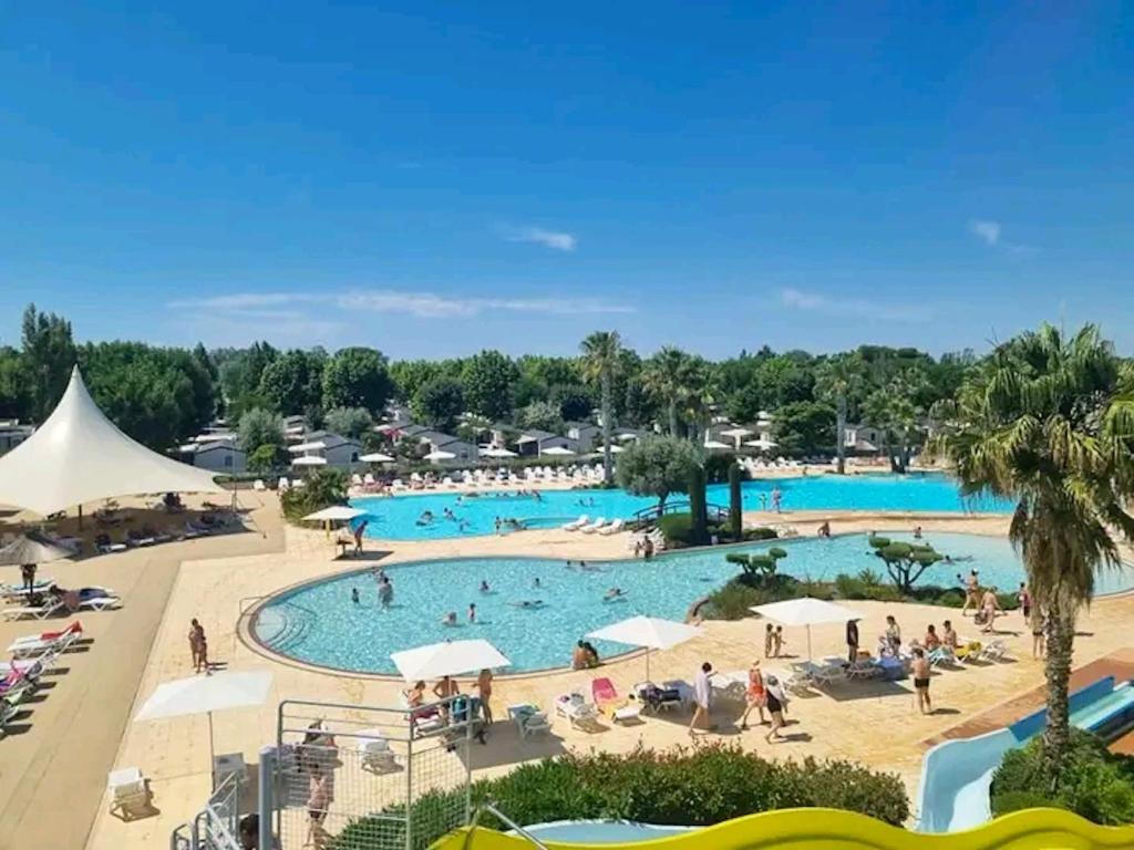 a view of the pool at the resort at Bungalow de 3 chambres avec piscine partagee et terrasse a Vias a 1 km de la plage in Vias