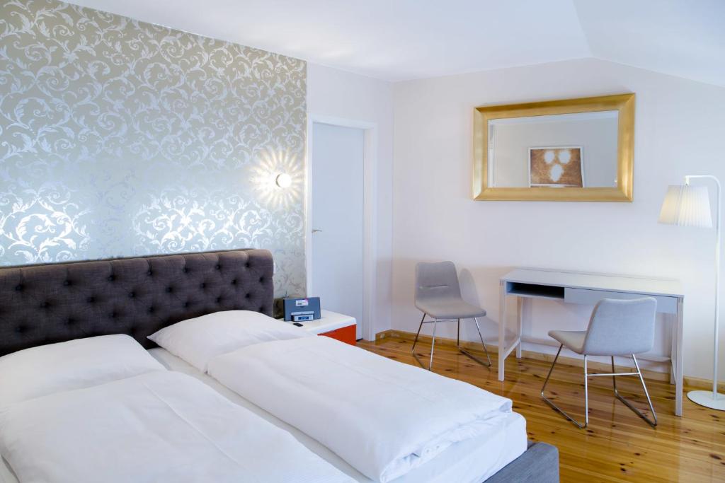 Postel nebo postele na pokoji v ubytování Hotel Residenz Begaswinkel