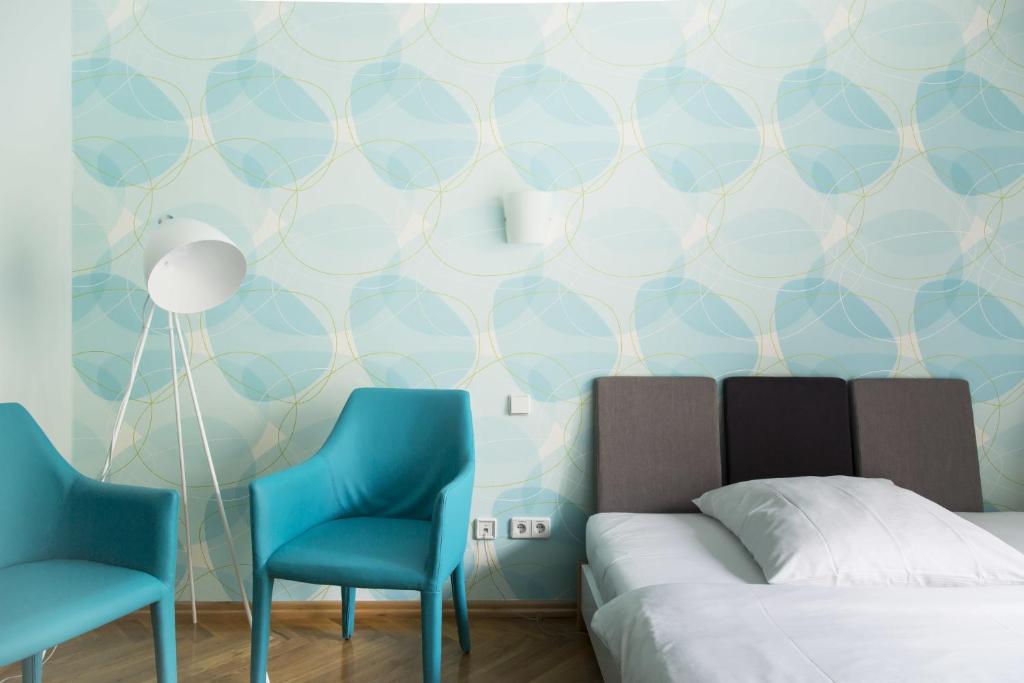 Postel nebo postele na pokoji v ubytování Hotel Residenz Begaswinkel